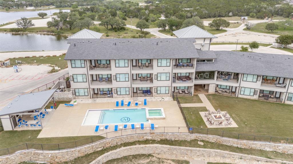 3412 Scenic Point Road, Unit 102 Graford, TX 76449 - Photo 2 of 31 an aerial view of a house with swimming pool