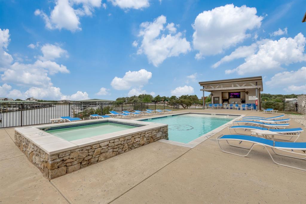 3412 Scenic Point Road, Unit 102 Graford, TX 76449 - Photo 24 of 31 a view of a swimming pool and an outdoor seating