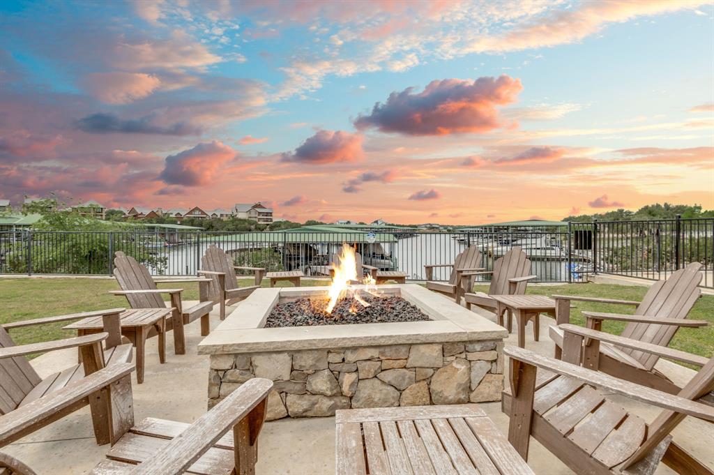 3412 Scenic Point Road, Unit 102 Graford, TX 76449 - Photo 26 of 31 a view of a terrace with lawn chairs