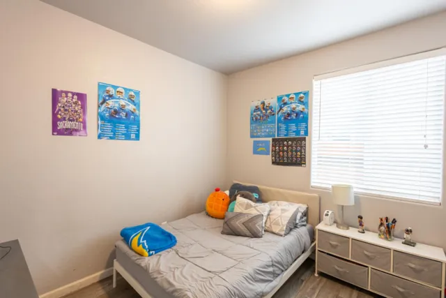 a bedroom with a bed and a window