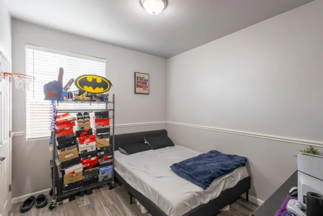 a bedroom with a bed and a window