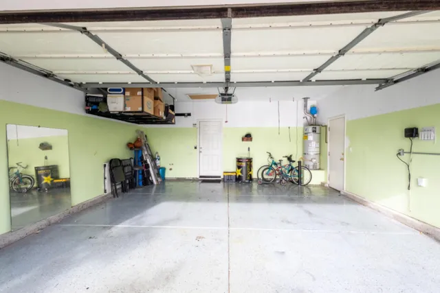a view of a garage with a bike and a car