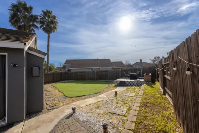 a view of a swimming pool with a tub and wooden floor