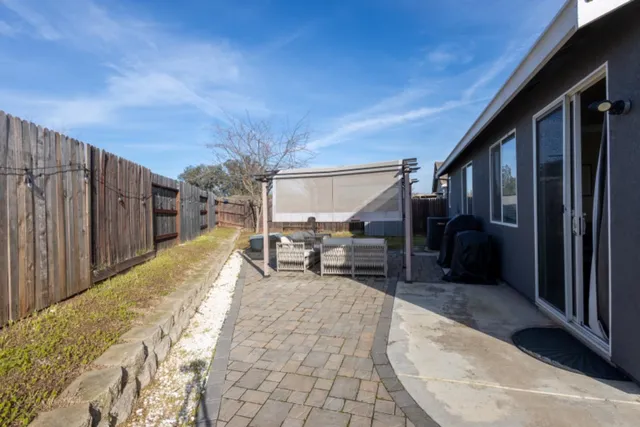 a view of a couches with wooden fence and roof