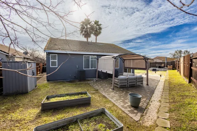 a view of a house with backyard tub and couches