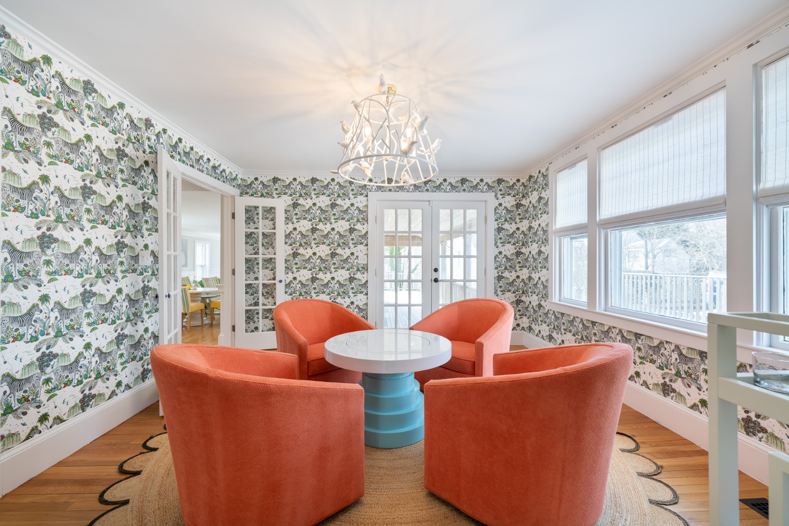 2 Silver Street Nantucket, MA 02554 - Photo 5 of 30 a living room with patio furniture and a chandelier