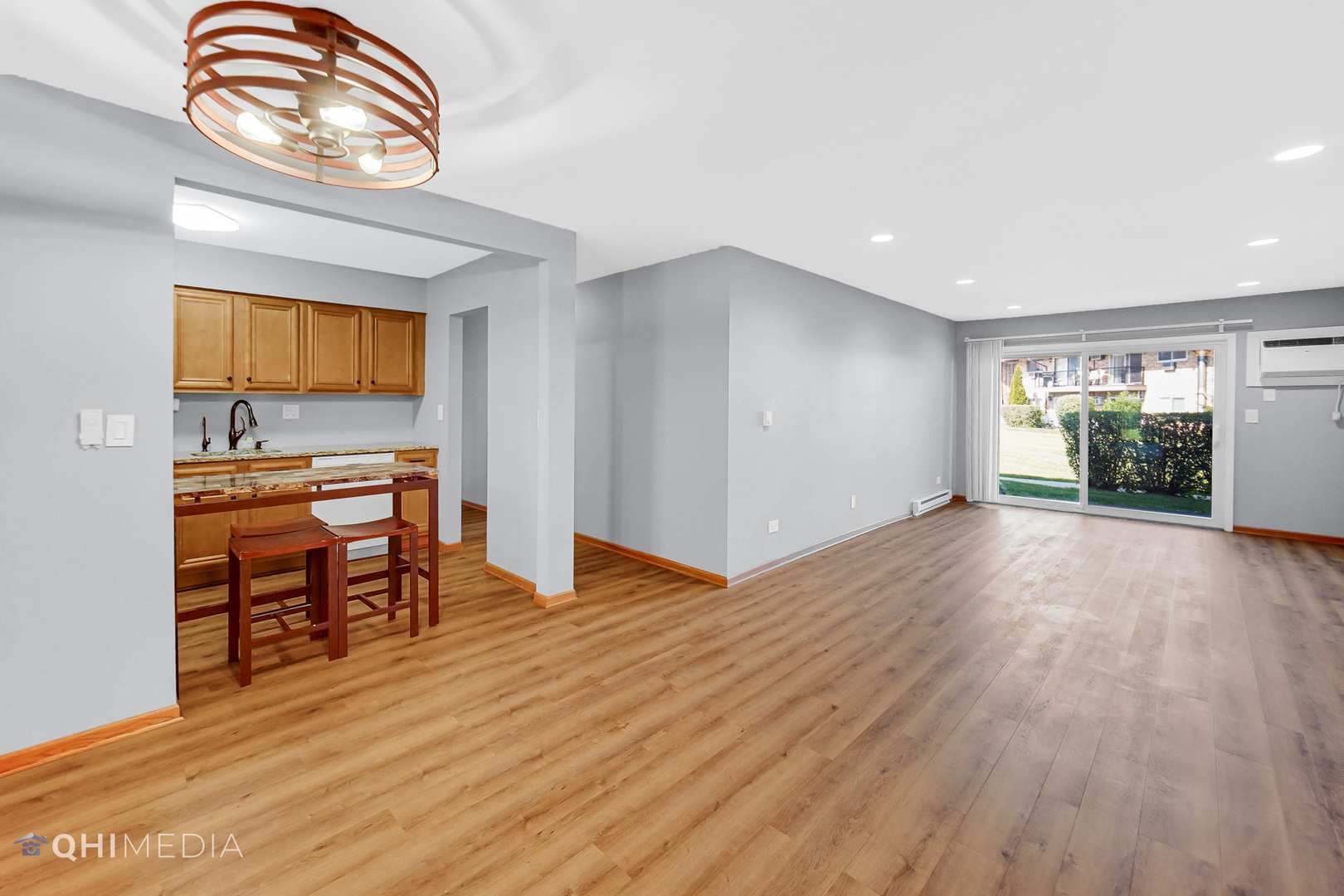 838 East Old Willow Road, Unit 103 Prospect Heights, IL 60070 - Photo 4 of 20 a view of kitchen and dining room with wooden floor