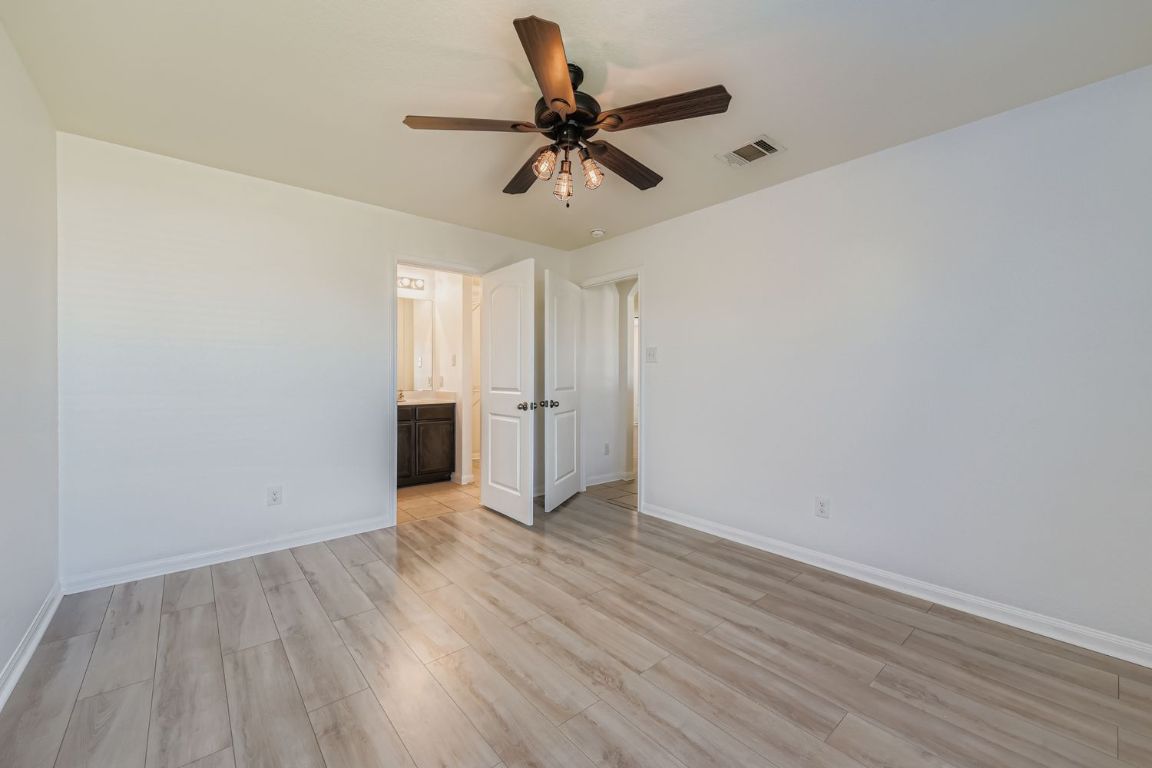 232 Millers Loop Jarrell, TX 76537 - Photo 16 of 34 wooden floor in an empty room