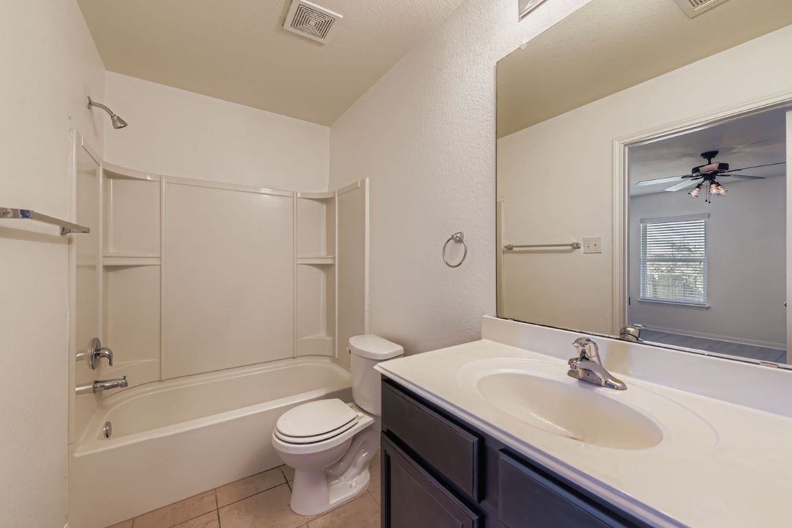 232 Millers Loop Jarrell, TX 76537 - Photo 17 of 34 a bathroom with a sink a toilet and shower