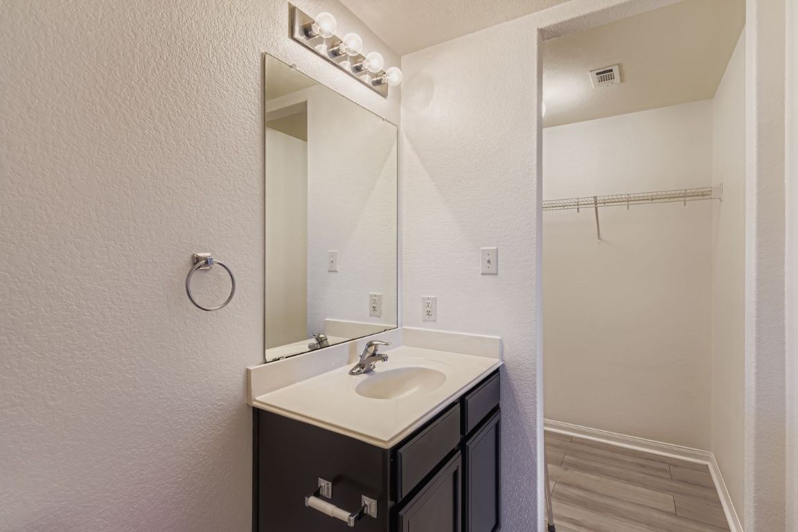 232 Millers Loop Jarrell, TX 76537 - Photo 18 of 34 a bathroom with a sink toilet and mirror