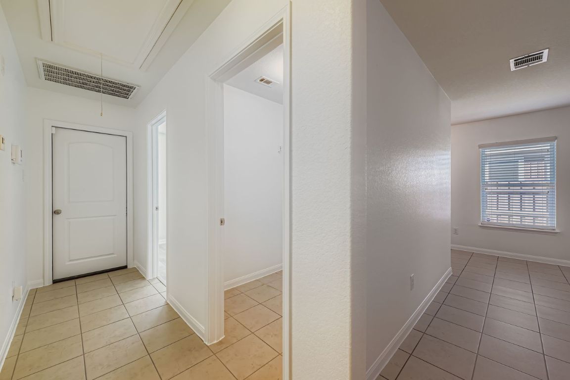 232 Millers Loop Jarrell, TX 76537 - Photo 27 of 34 a view of a hallway to rooms