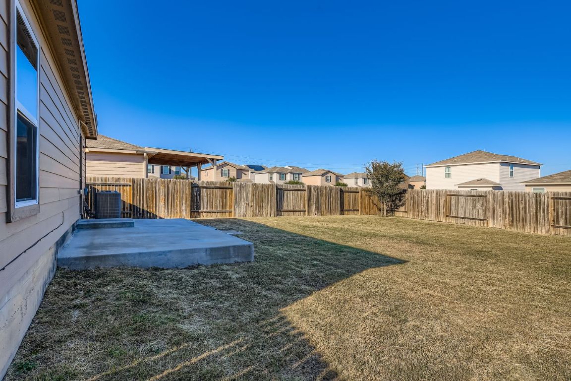 232 Millers Loop Jarrell, TX 76537 - Photo 30 of 34 a view of a house with a yard