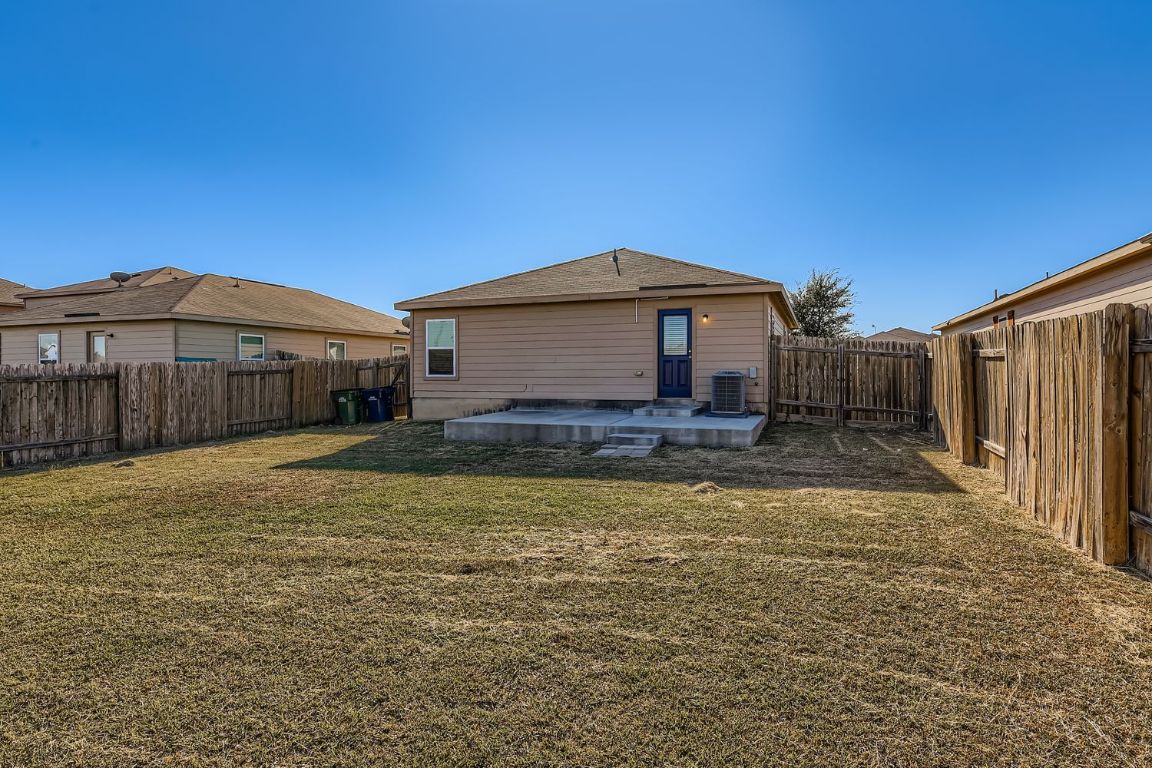 232 Millers Loop Jarrell, TX 76537 - Photo 33 of 34 a front view of a house with a yard