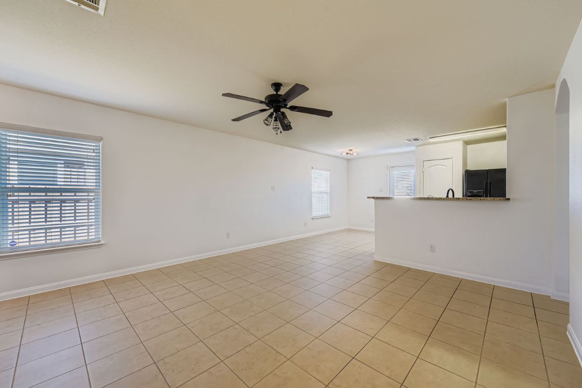232 Millers Loop Jarrell, TX 76537 - Photo 9 of 34 a view of a kitchen with a dishwasher and a microwave