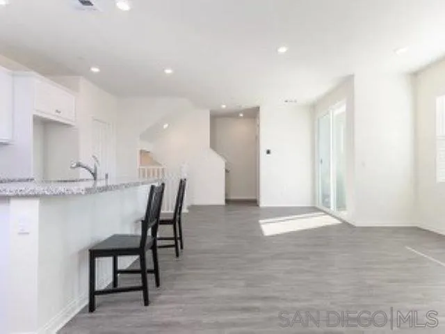 365 Fitzpatrick Road, Unit 102 San Marcos, CA 92069 - Photo 3 of 11 a view of kitchen with a sink stainless steel appliances and cabinets