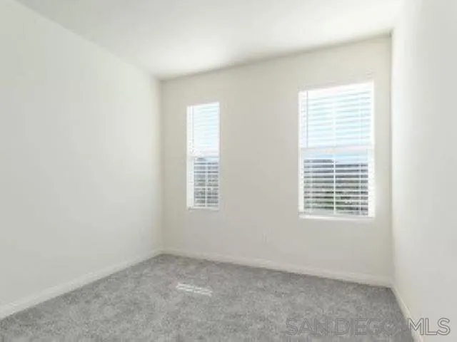 365 Fitzpatrick Road, Unit 102 San Marcos, CA 92069 - Photo 10 of 11 an empty room with a window
