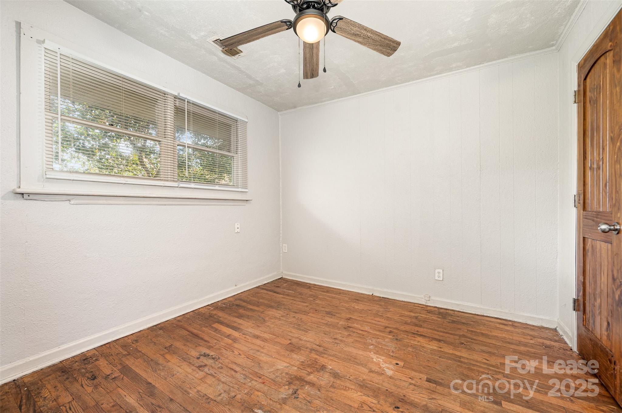 2407 Julia Avenue, Unit 3 Charlotte, NC 28206 - Photo 11 of 13 a view of an empty room with a window