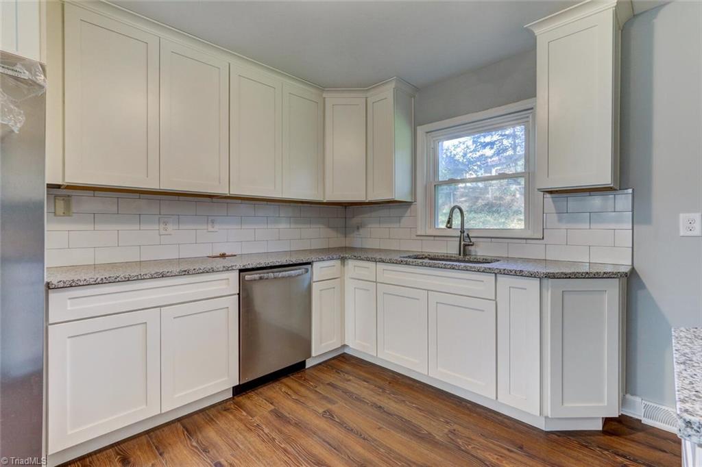 1211 Robin Road Eden, NC 27288 - Photo 5 of 21 New cabinets, tile black spash, granite counters