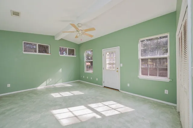 a view of empty room with windows
