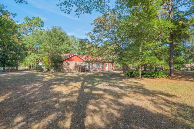 a view of a street with a yard