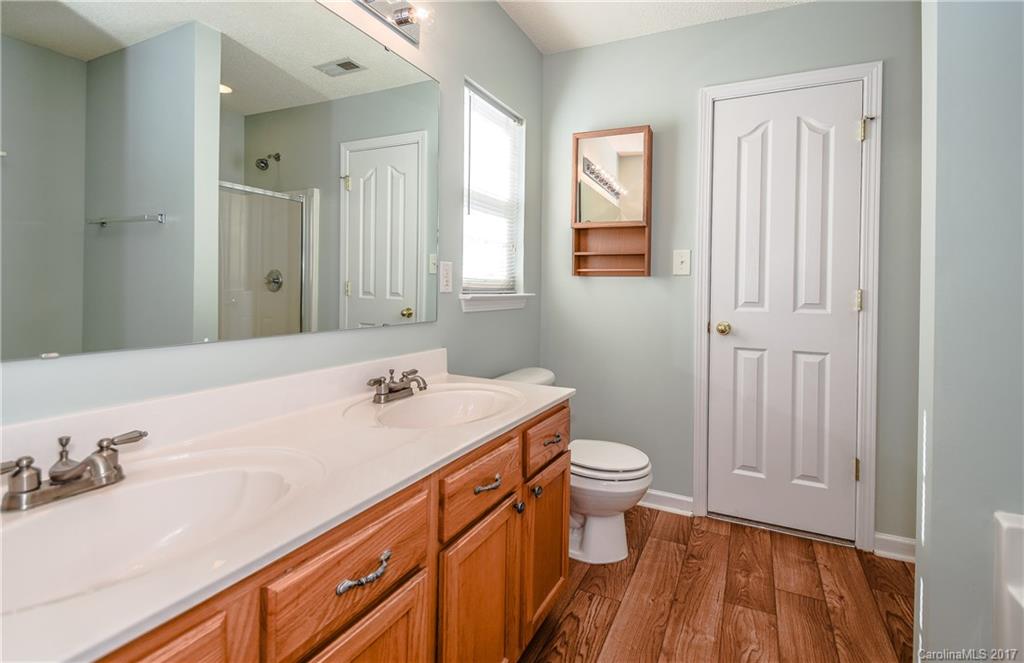 13422 Latta Gordon Road Huntersville, NC 28078 - Photo 14 of 24 a bathroom with a sink a toilet and a mirror