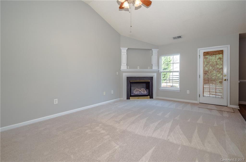 13422 Latta Gordon Road Huntersville, NC 28078 - Photo 8 of 24 a view of an empty room with a window and fireplace
