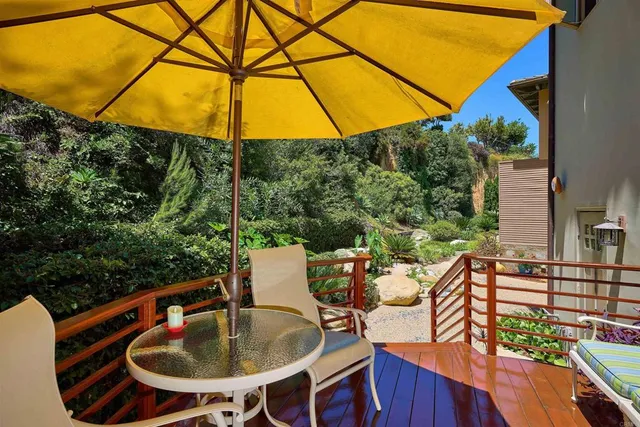 a living room filled with furniture and a flat screen tv