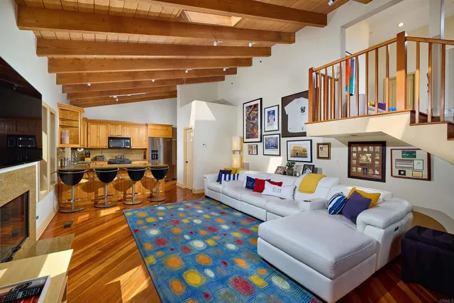 a living room with furniture fireplace and flat screen tv