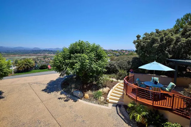 a living room with furniture and paintings on the wall