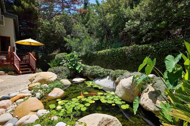 a view of a chairs and table in the balcony