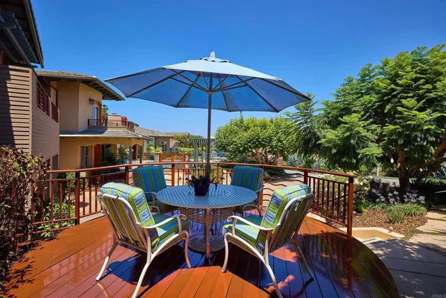 a view of a patio with a table chairs and a table