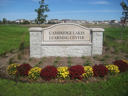 2369 Upland Road Pingree Grove, IL 60140 - Photo 18 of 18 a view of a sign board with a yard