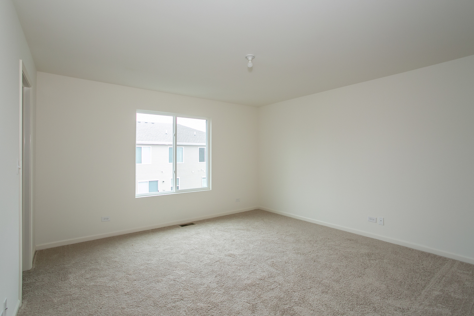 2369 Upland Road Pingree Grove, IL 60140 - Photo 6 of 18 an empty room with a window