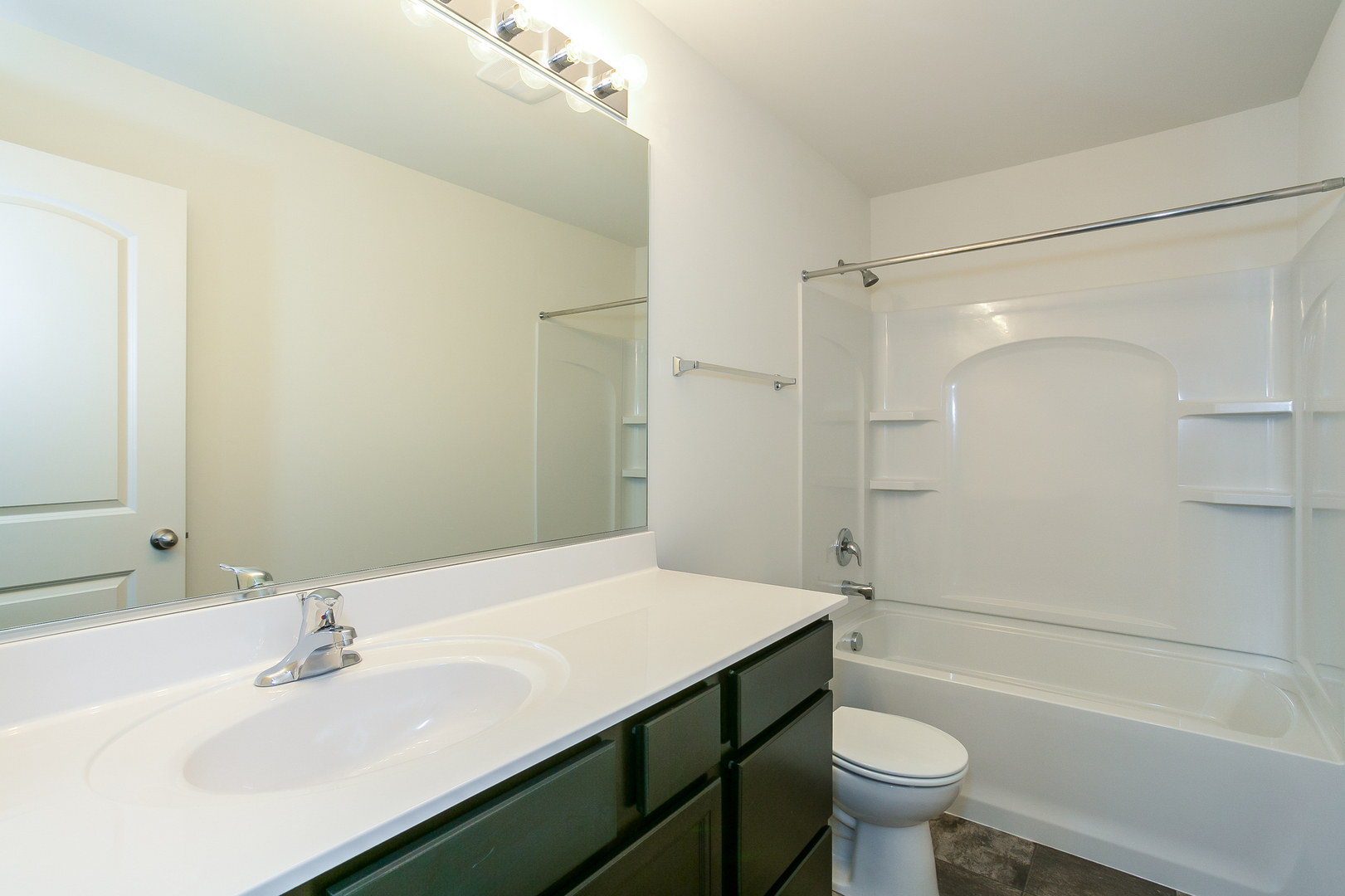 2369 Upland Road Pingree Grove, IL 60140 - Photo 8 of 18 a bathroom with a sink mirror toilet and bathtub