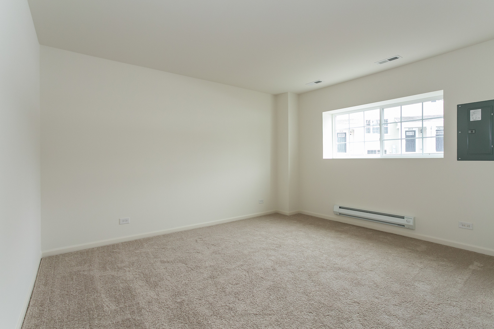 2369 Upland Road Pingree Grove, IL 60140 - Photo 9 of 18 an empty room with windows