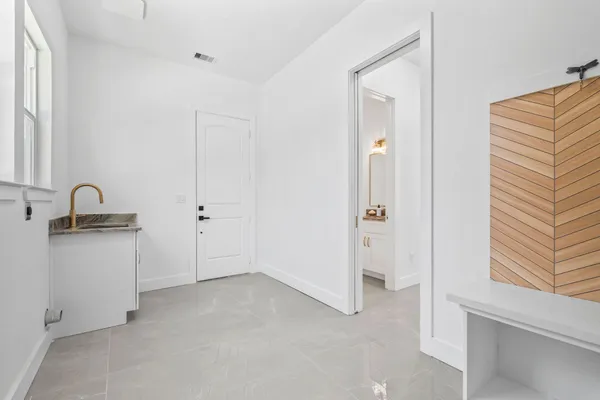 a view of room with window and cabinet