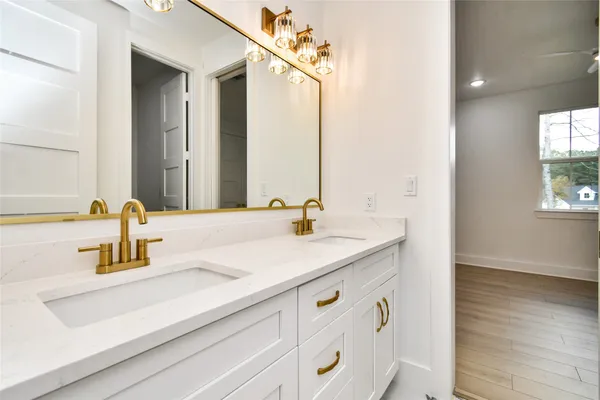 a bathroom with a shower and a sink