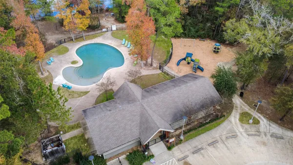 an aerial view of a house with a yard and garden