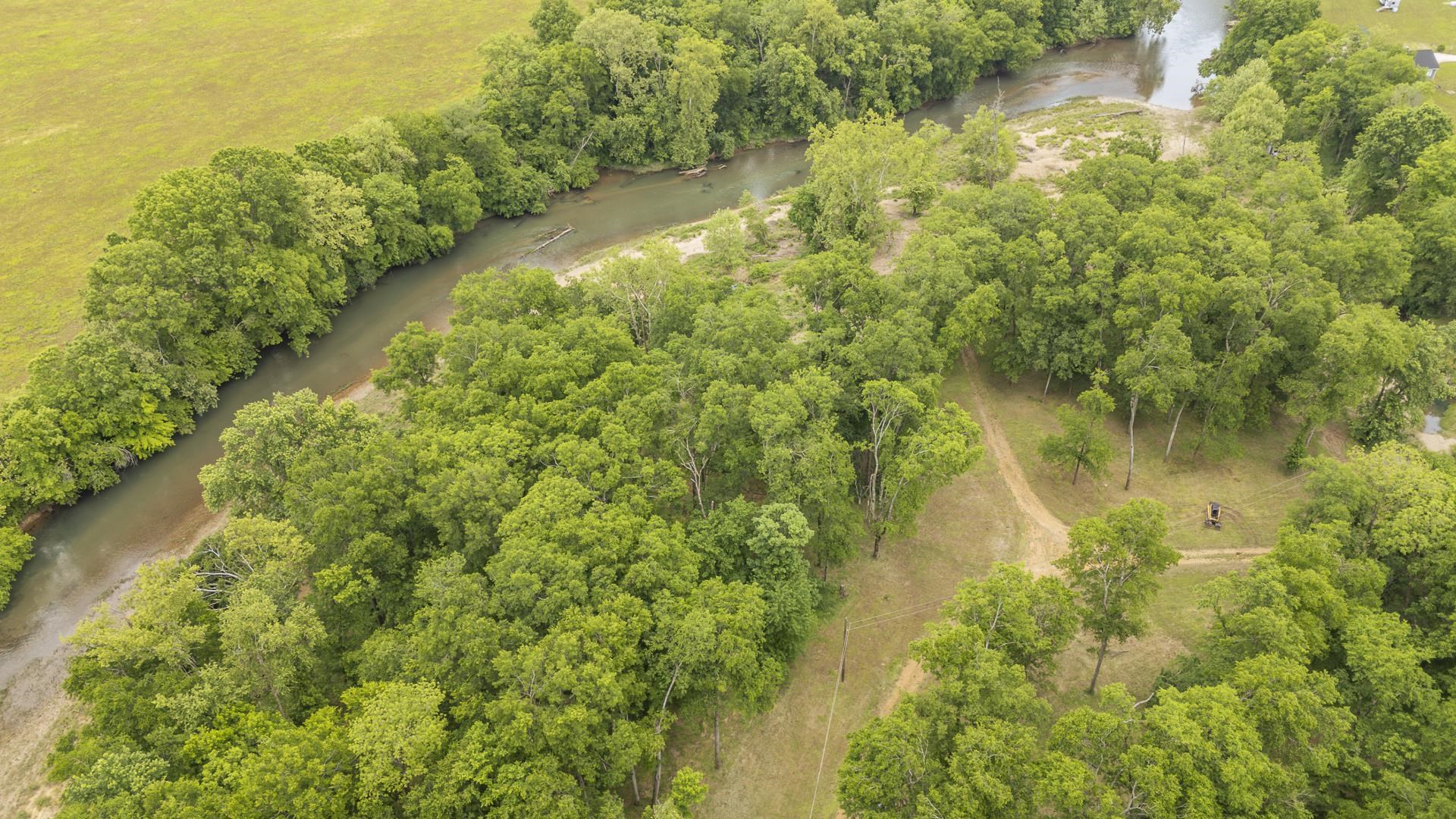 Buffalo River Road Waynesboro, TN 38485 - Photo 16 of 40 a view of a lake with a house