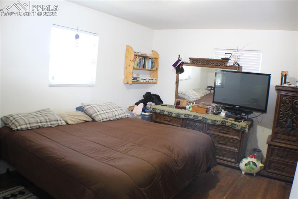 29454 County Farm Road Pueblo, CO 81006 - Photo 12 of 25 a bedroom with a bed and a flat screen tv