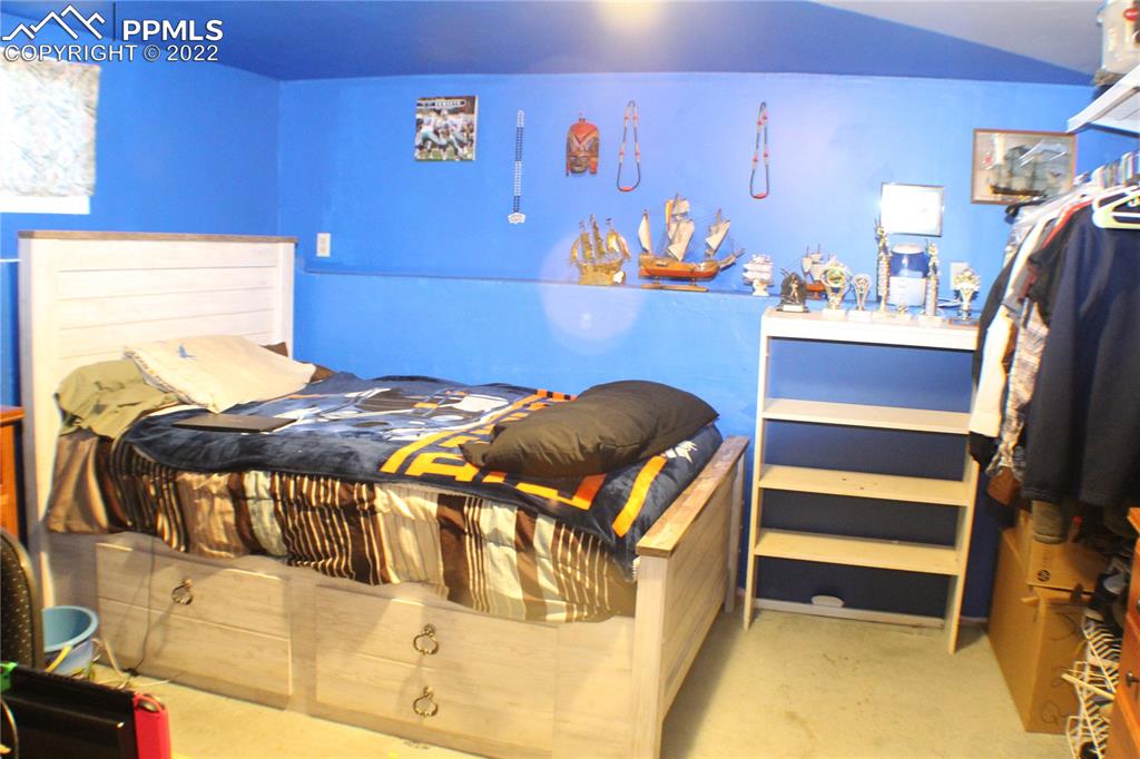 29454 County Farm Road Pueblo, CO 81006 - Photo 13 of 25 a bedroom with a bed and dresser