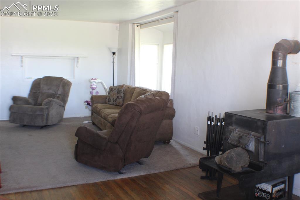 29454 County Farm Road Pueblo, CO 81006 - Photo 2 of 25 a living room with furniture and a flat screen tv