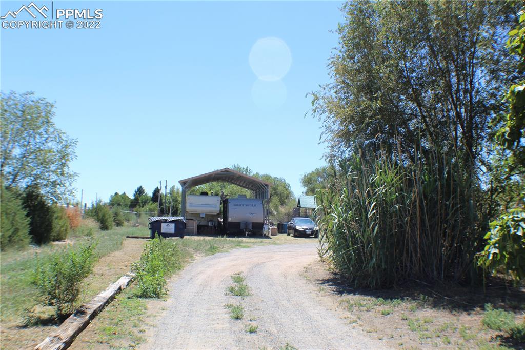 29454 County Farm Road Pueblo, CO 81006 - Photo 21 of 25 a view of a house with a yard