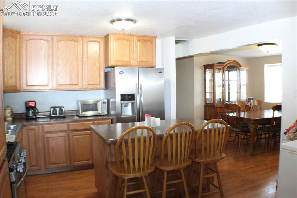 29454 County Farm Road Pueblo, CO 81006 - Photo 4 of 25 a kitchen with granite countertop a sink cabinets and stainless steel appliances