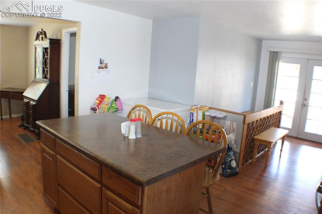 29454 County Farm Road Pueblo, CO 81006 - Photo 6 of 25 a view of kitchen island with wooden floor