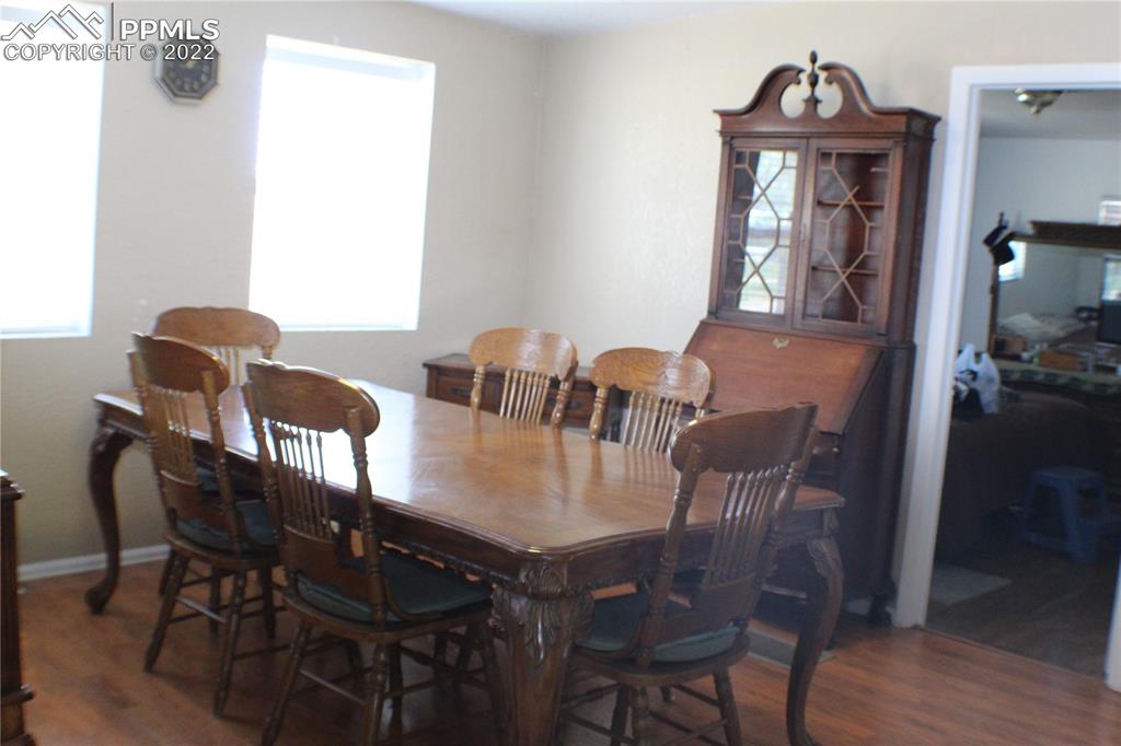 29454 County Farm Road Pueblo, CO 81006 - Photo 8 of 25 a view of a dining room with furniture and wooden floor