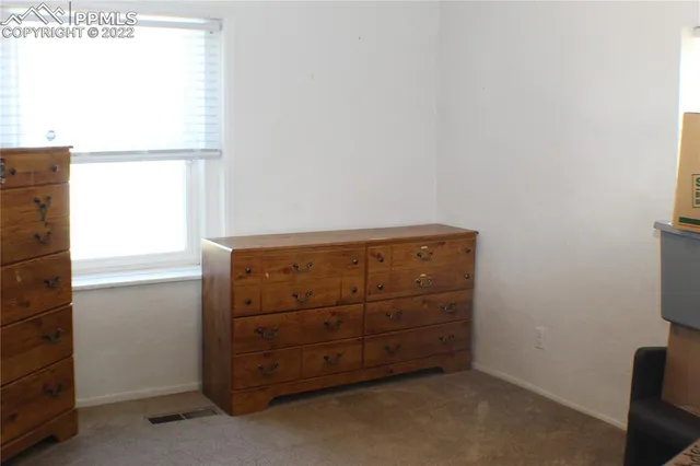 a view of a closet in kitchen