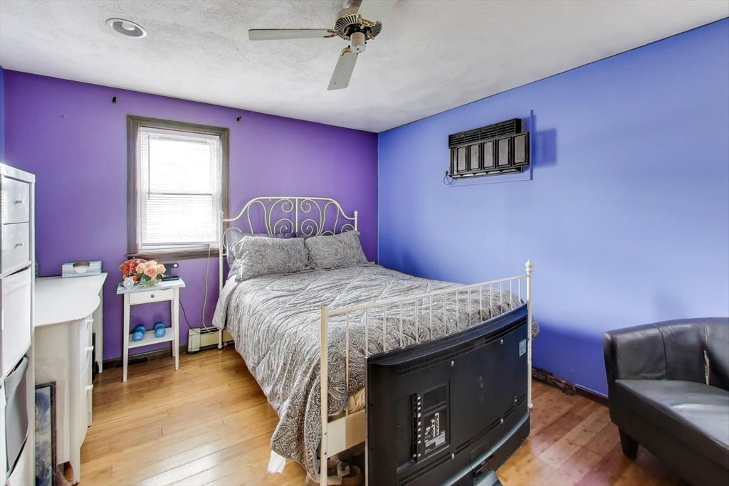 3 River St Court Lynn, MA 01905 - Photo 11 of 24 a bedroom with a bed and a couch