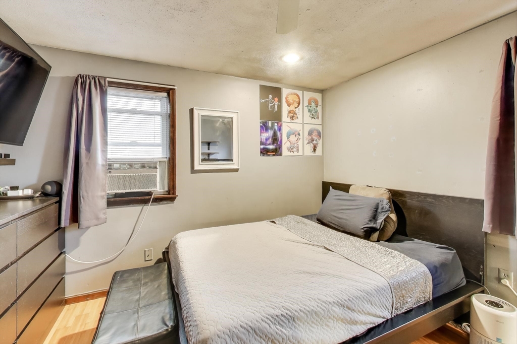 3 River St Court Lynn, MA 01905 - Photo 13 of 24 a bedroom with a bed and glass windows