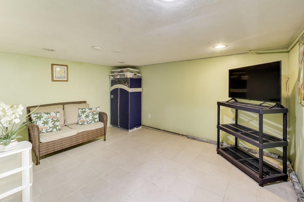 3 River St Court Lynn, MA 01905 - Photo 17 of 24 a view of a livingroom with furniture and a flat screen tv